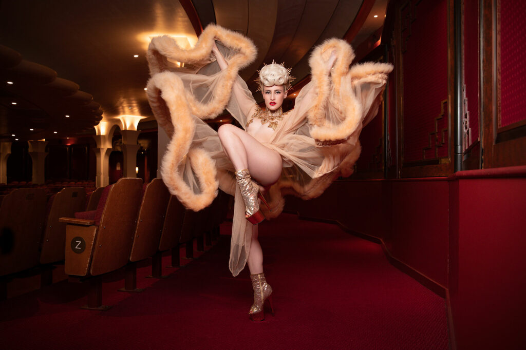 Glamonatrix Cast: burlesque Performer Tosca poses in her Boudoir By D'lish robe ahead of Dita Von Teese's UK Glamonatrix tour 